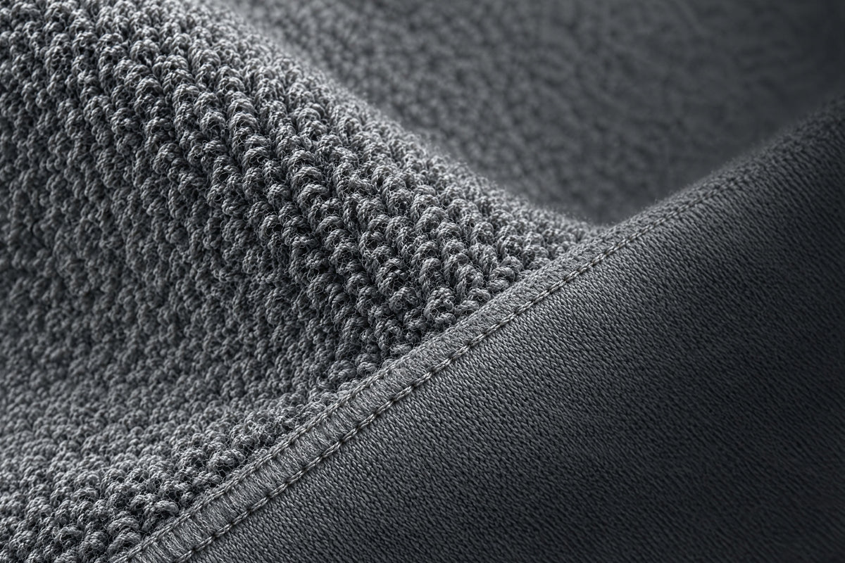 240 GSM organic cotton loopback french terry in raking light, single-needle taped shoulder seam