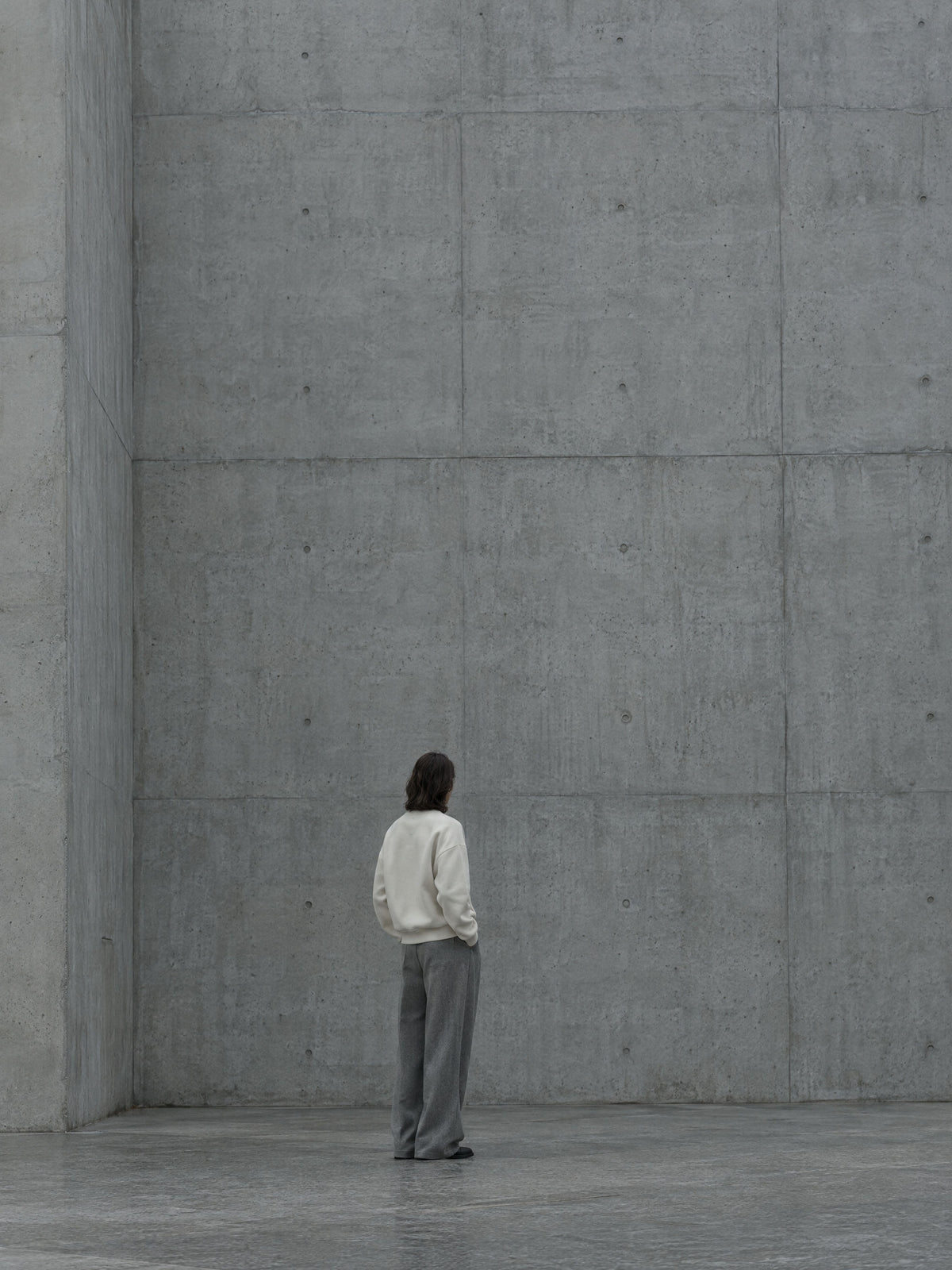 Bedrock basics worn against a poured-concrete wall